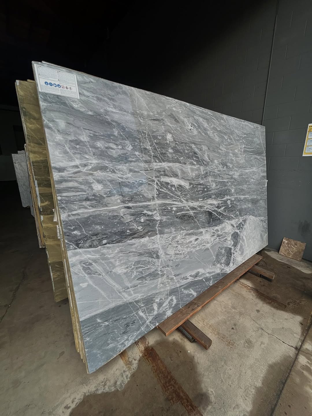 Grey veined marble slab on display